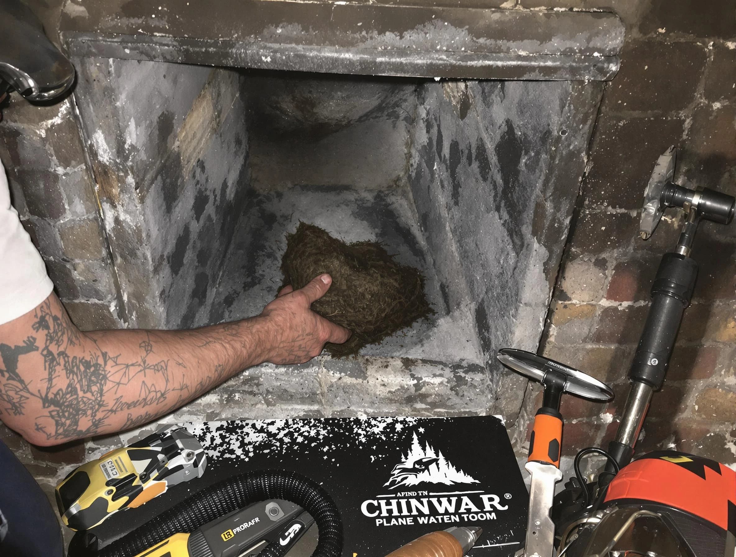 Marietta Chimney Sweep safely removing debris and screening chimney in Marietta, GA