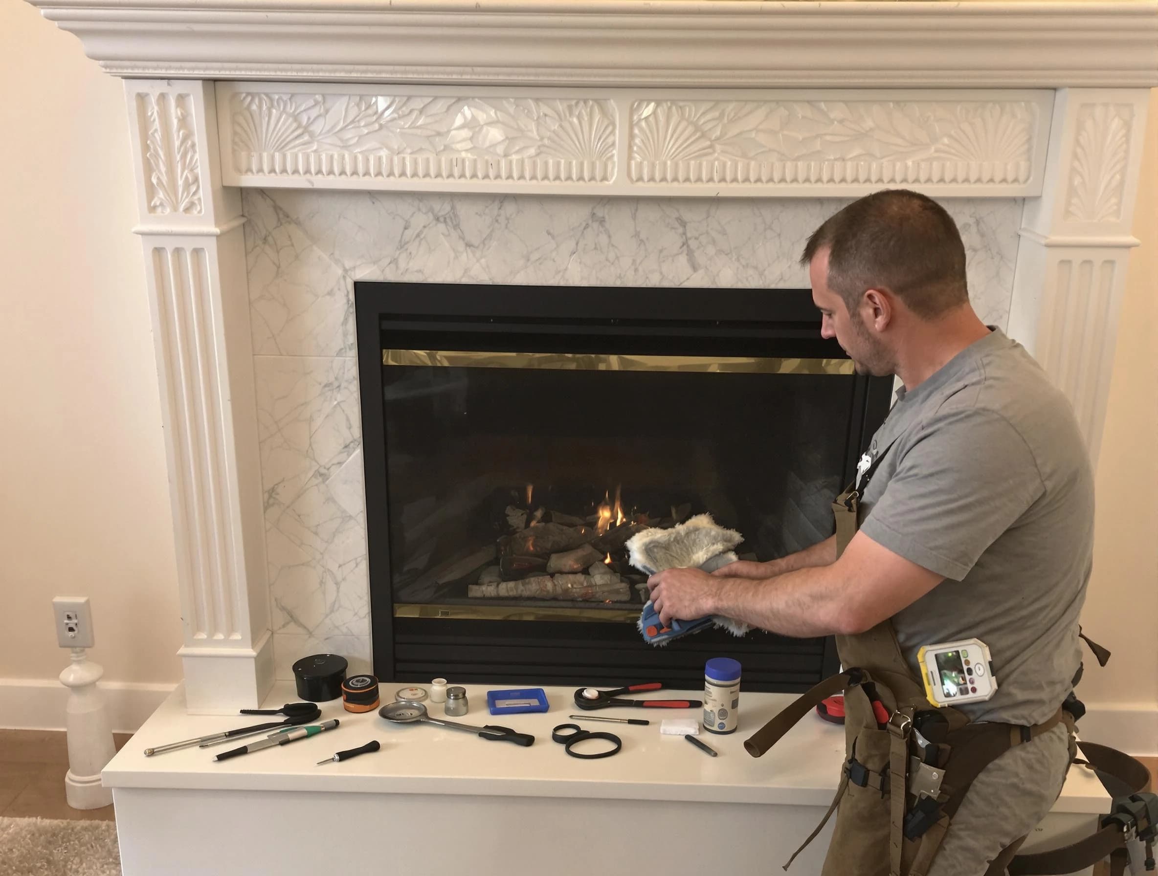 Marietta Chimney Sweep performing fireplace maintenance in Marietta, GA